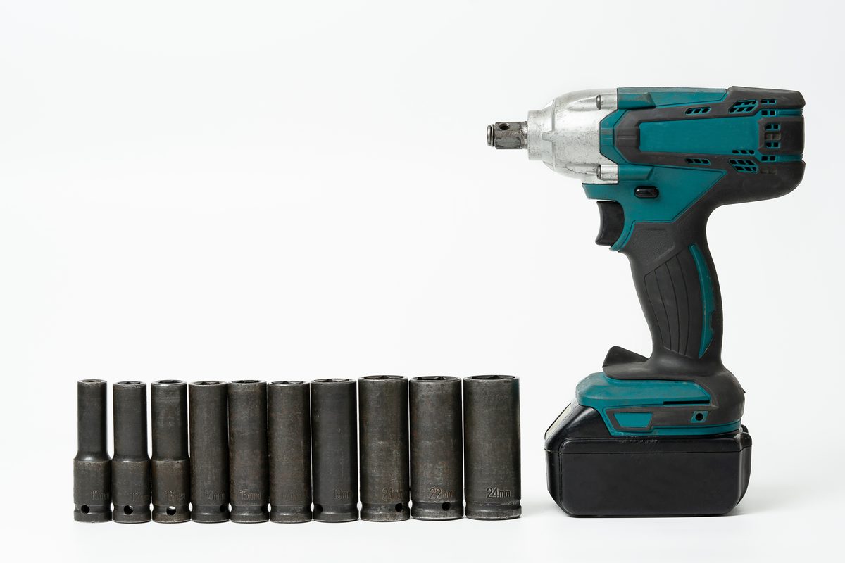 Cordless impact wrench paired with black deep impact sockets